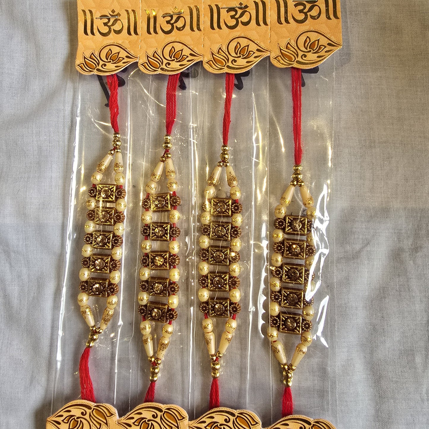 Traditional Beaded Rakhi Set for Brothers – Elegant Gold & Pearl