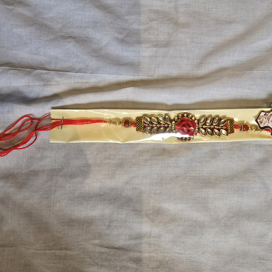 Floral Red Rakhi with Kundan Leaves – Premium Raksha Bandhan Thread