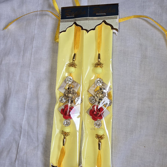Ganesha Rakhi Set with Yellow Thread & Floral Accents – Divine Raksha Bandhan Rakhis