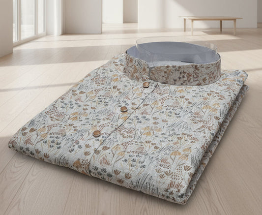 Floral-patterned mat on a wooden floor in a minimalistic room with large windows.