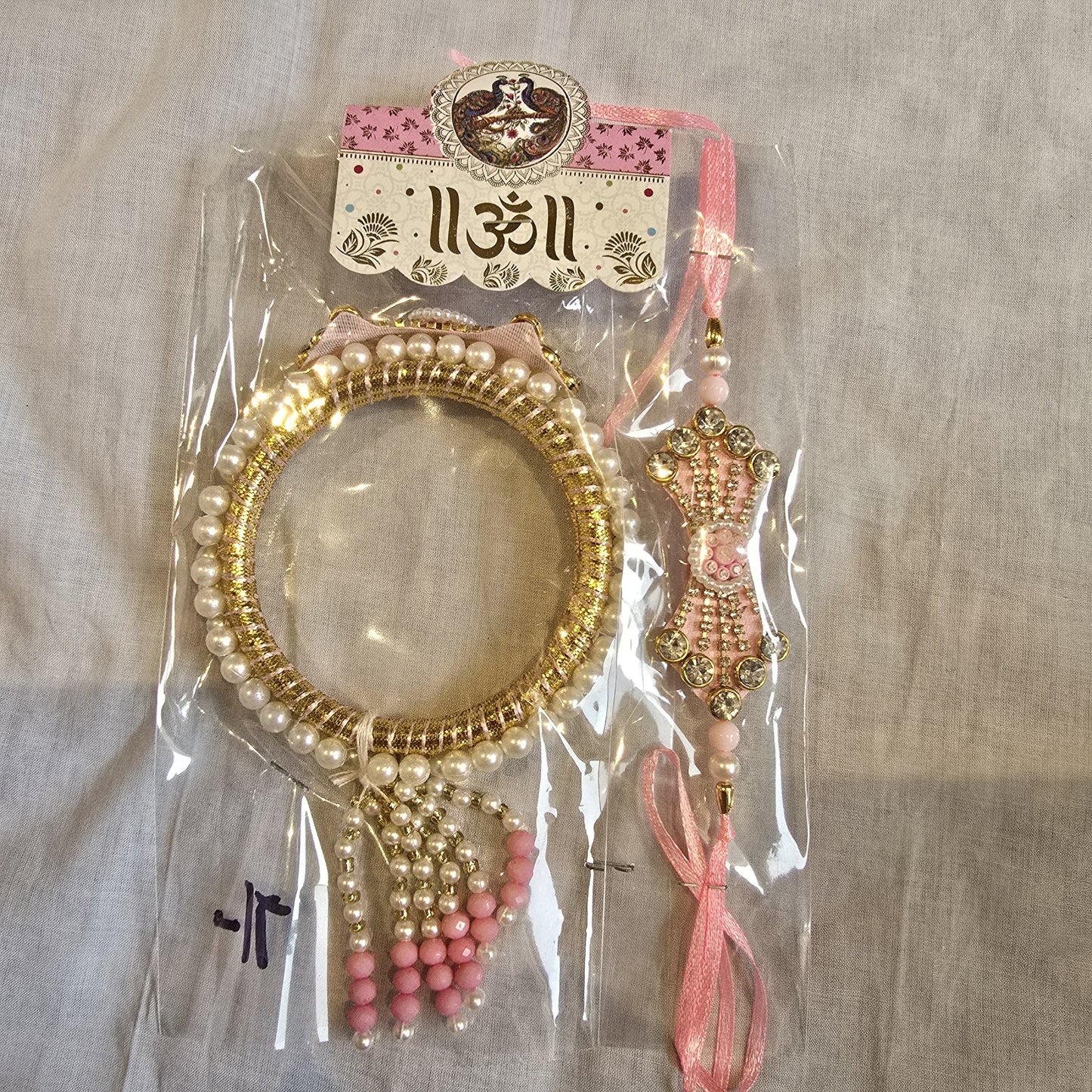 Pink Bhaiya Bhabhi Rakhi Set – Elegant Stone, Pearl Work & Tassels