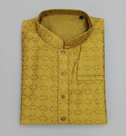 Yellow patterned shirt on a gray surface