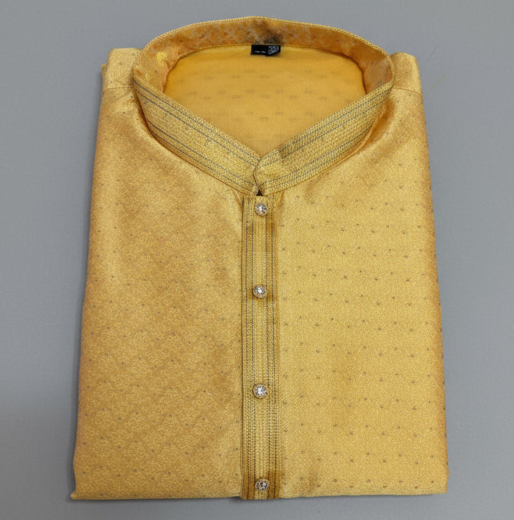 Folded yellow shirt with a textured pattern on a dark blue background


